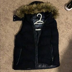 Puffy vest with a fur lined hood